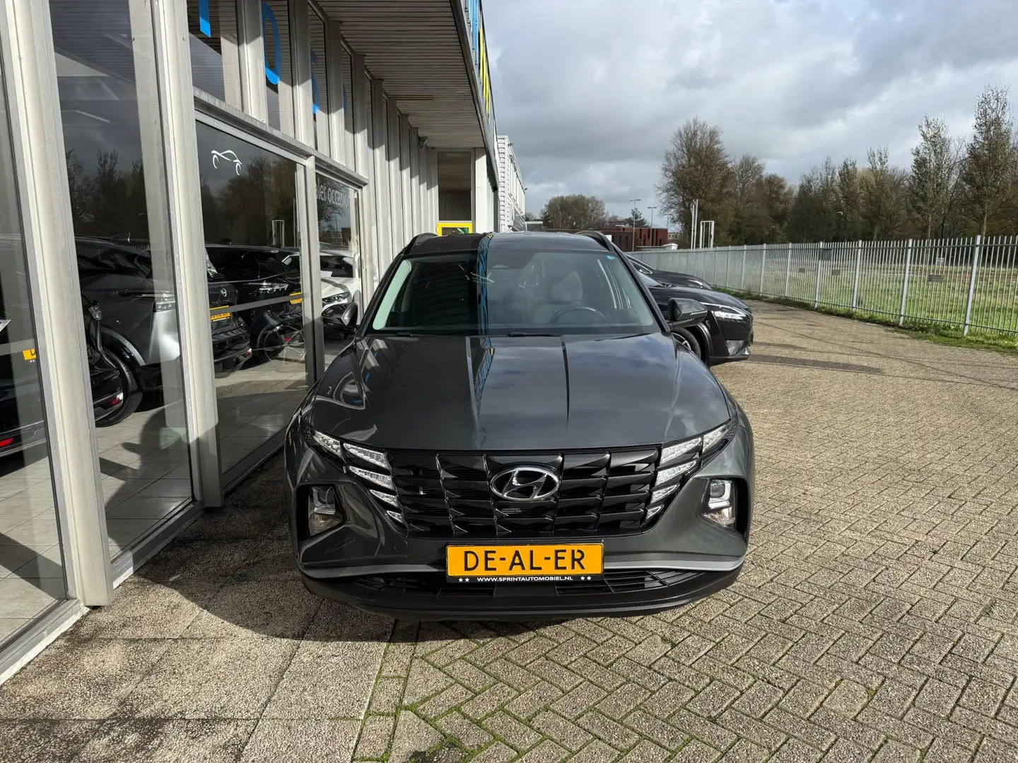 Hyundai TUCSON 1.6 T-GDI PHEV Comfort 4WD 265PK / ACHTERUITRIJCAM Groen - 2