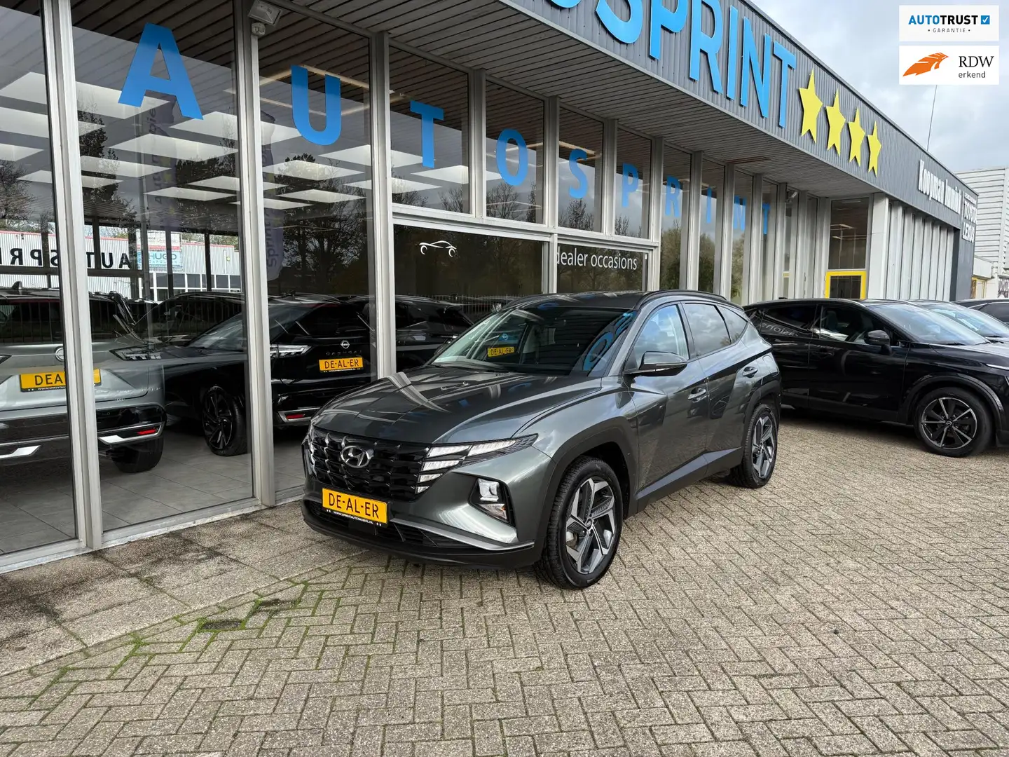 Hyundai TUCSON 1.6 T-GDI PHEV Comfort 4WD 265PK / ACHTERUITRIJCAM Groen - 1