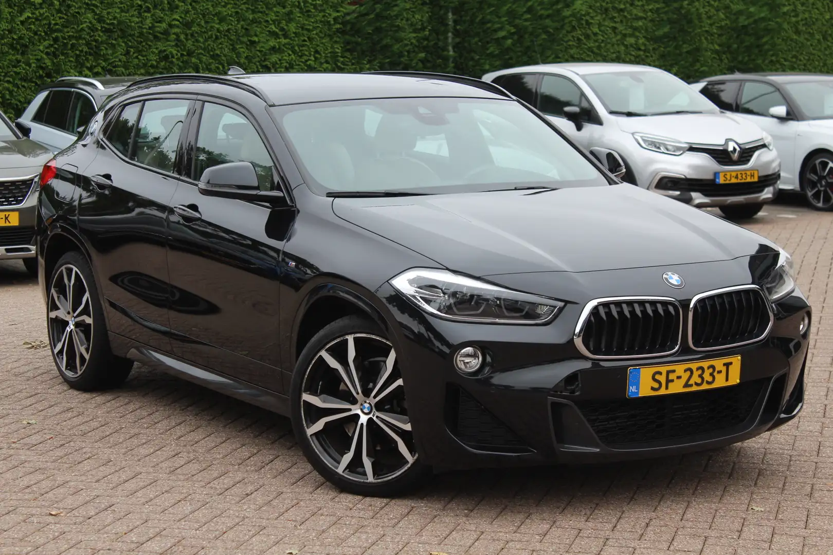 BMW X2 sDrive20i High Exe. M Sport 66.342 km!! / Camera / Zwart - 1