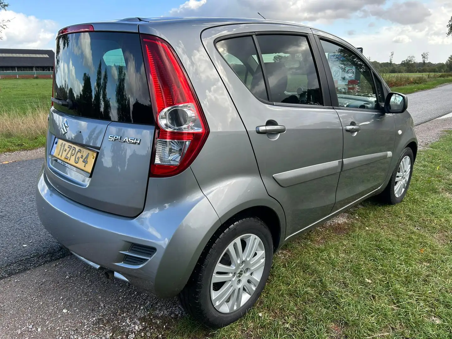Suzuki Splash 1.2 Exclusive EASSS top onderhouden met stoelverwa Grijs - 2