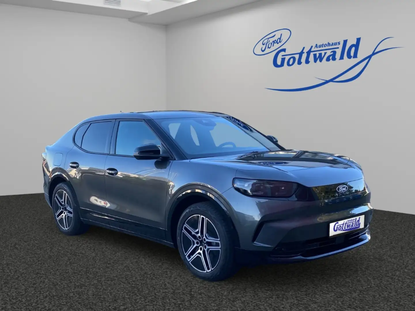 Ford Capri Premium AWD 79kWh AHK Wärmepumpe Panoramadach Fahr Grau - 1