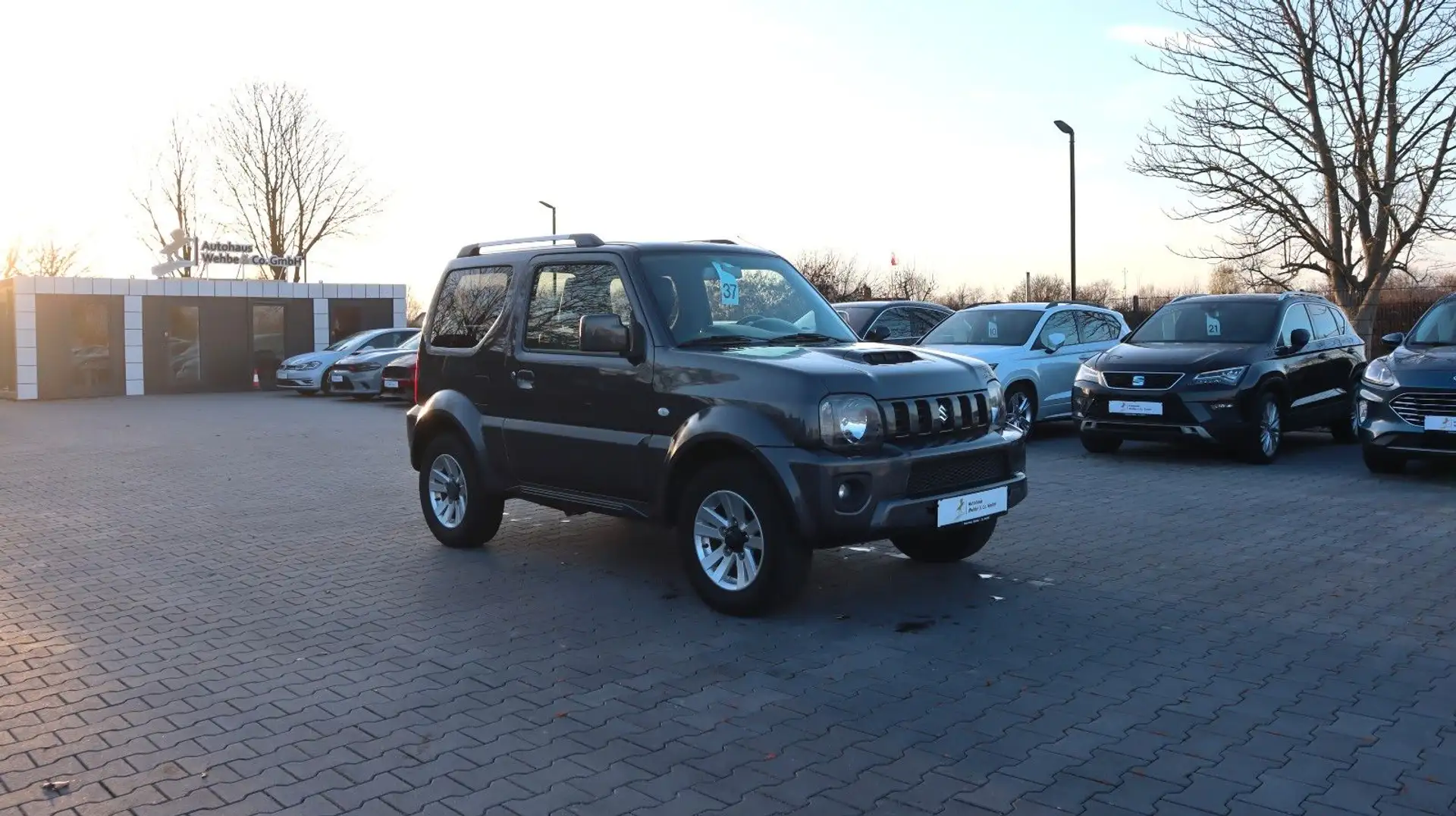 Suzuki Jimny Style 4x4 Leder Navi SitzHz. Klima AHK Grau - 1