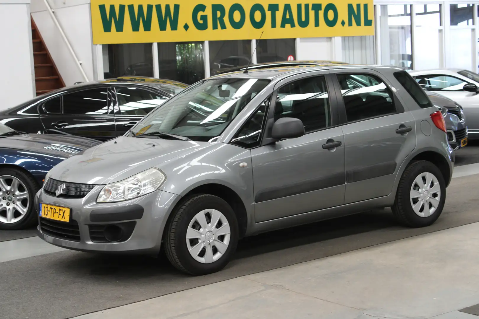Suzuki SX4 1.5 Base 79.825km NAP, Airco, Trekhaak, Stuurbekra Grijs - 1