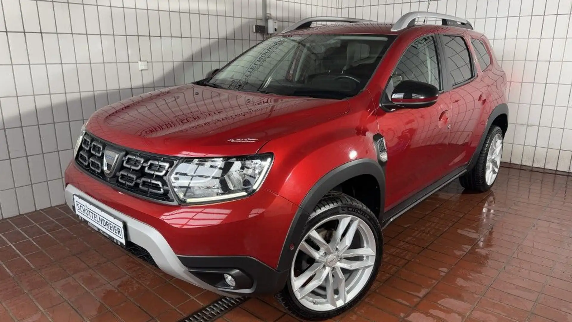 Dacia Duster TCe 150Sondermodell Adventure*AHK*19ZOLL*1.HAND* Rouge - 1