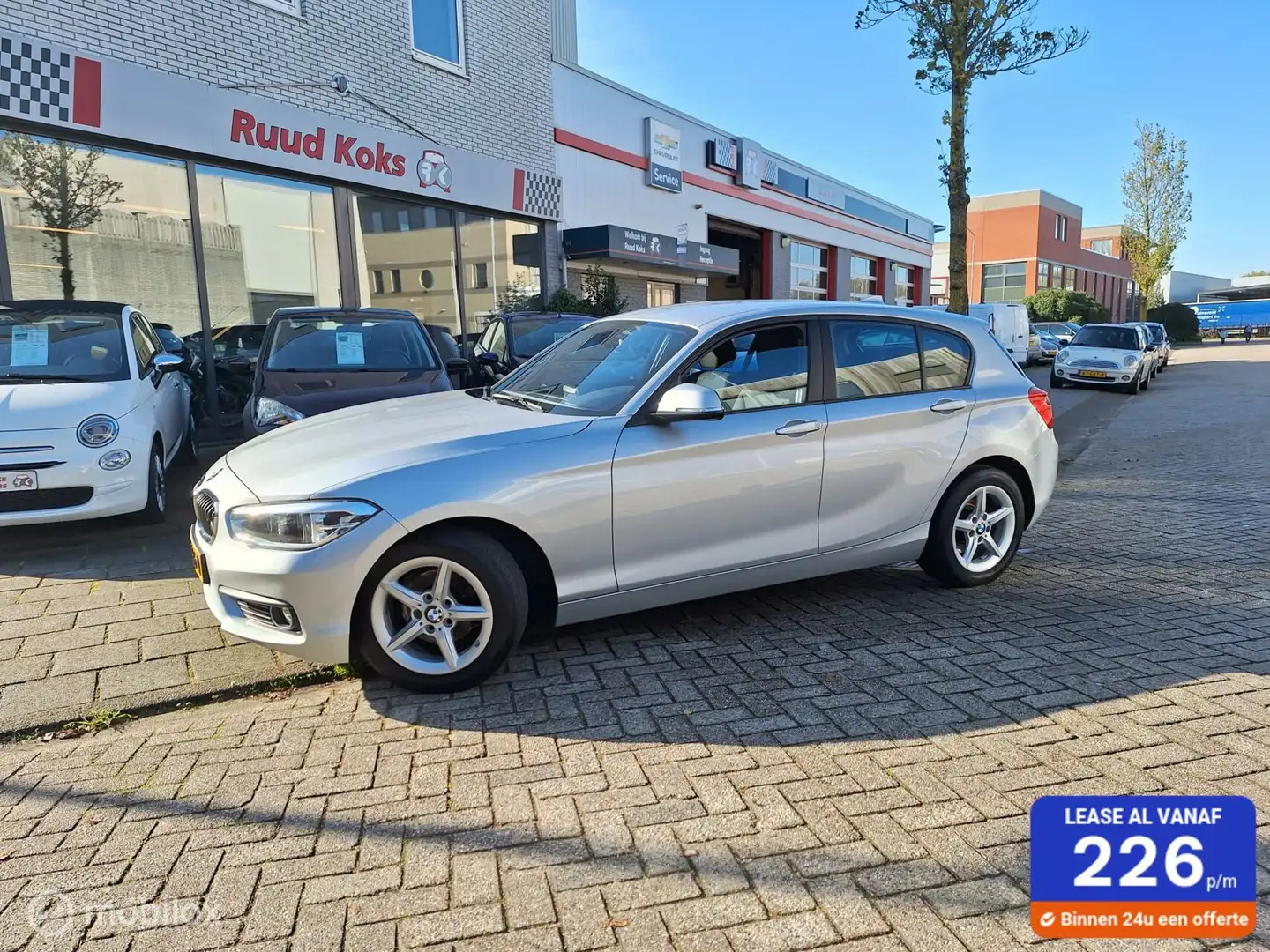 BMW 116 1-SERIE 116i EXECUTIVE / Navigatie / Climate contr Grijs - 1