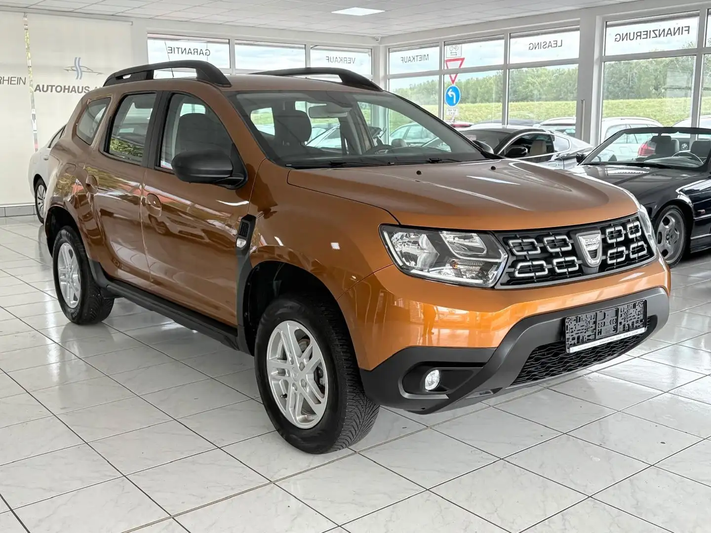 Dacia Duster II Comfort+Tempomat+Klima+ECO-Mode+1.Hand Orange - 1