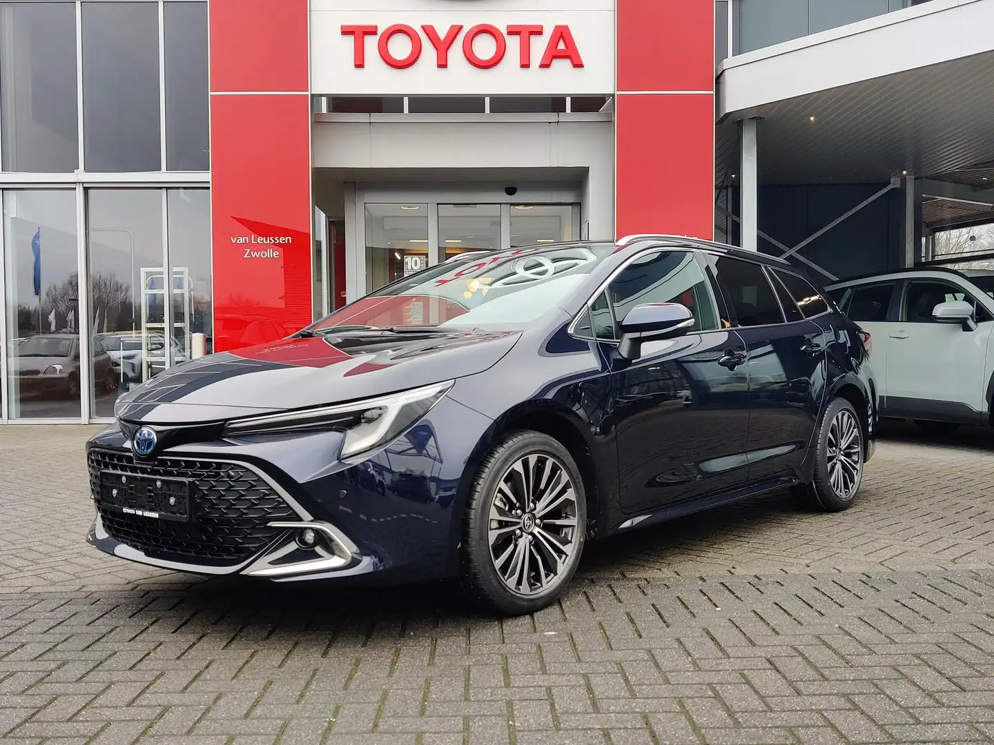 Toyota Corolla Touring Sports HYBRID 140 DYNAMIC NIEUW DIRECT LEV Blauw - 1