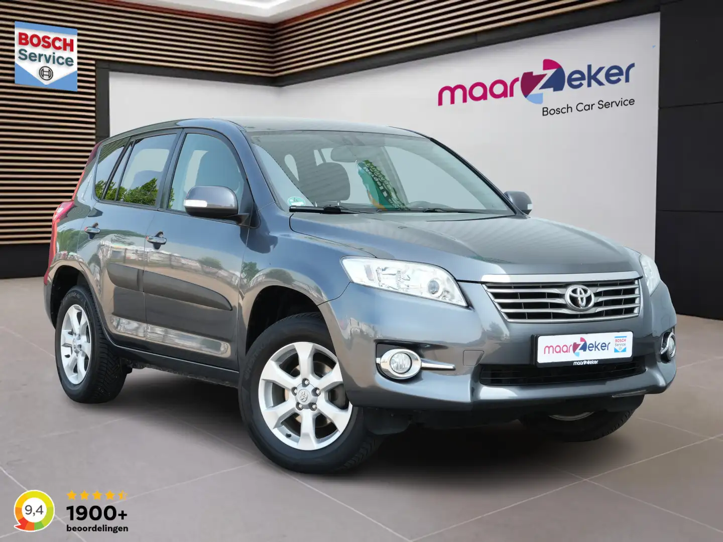 Toyota RAV 4 2.0 VVTi 4x4 Dynamic ✅Afn. Trekhaak✅All Season✅App Grijs - 1