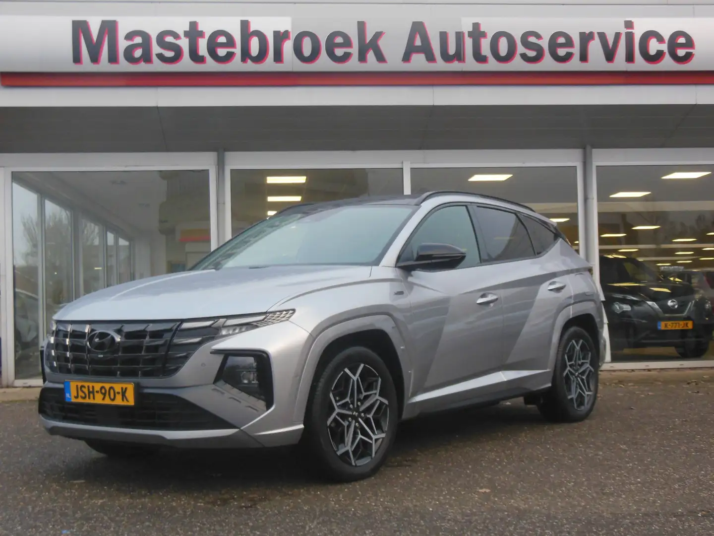 Hyundai TUCSON 1.6 T-GDI PHEV Premium Sky 4WD Staat in Hardenberg Grau - 1