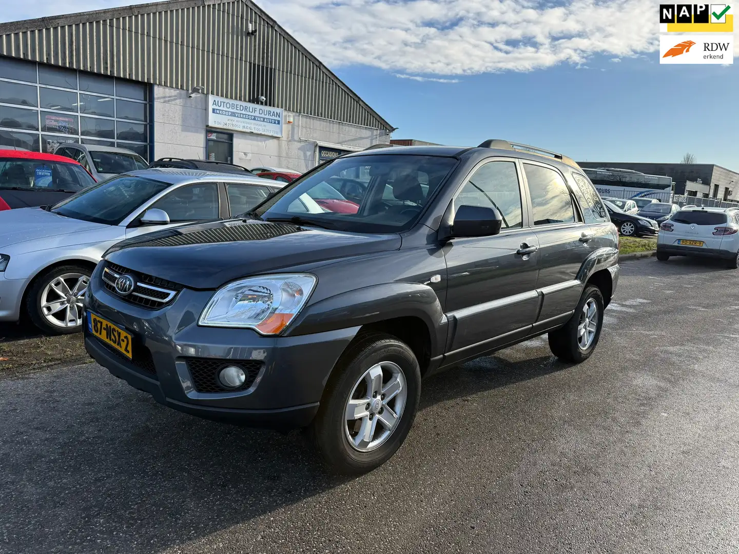 Kia Sportage 2.0 CVVT X-tra Airco Bj:2010 NAP! Grijs - 1