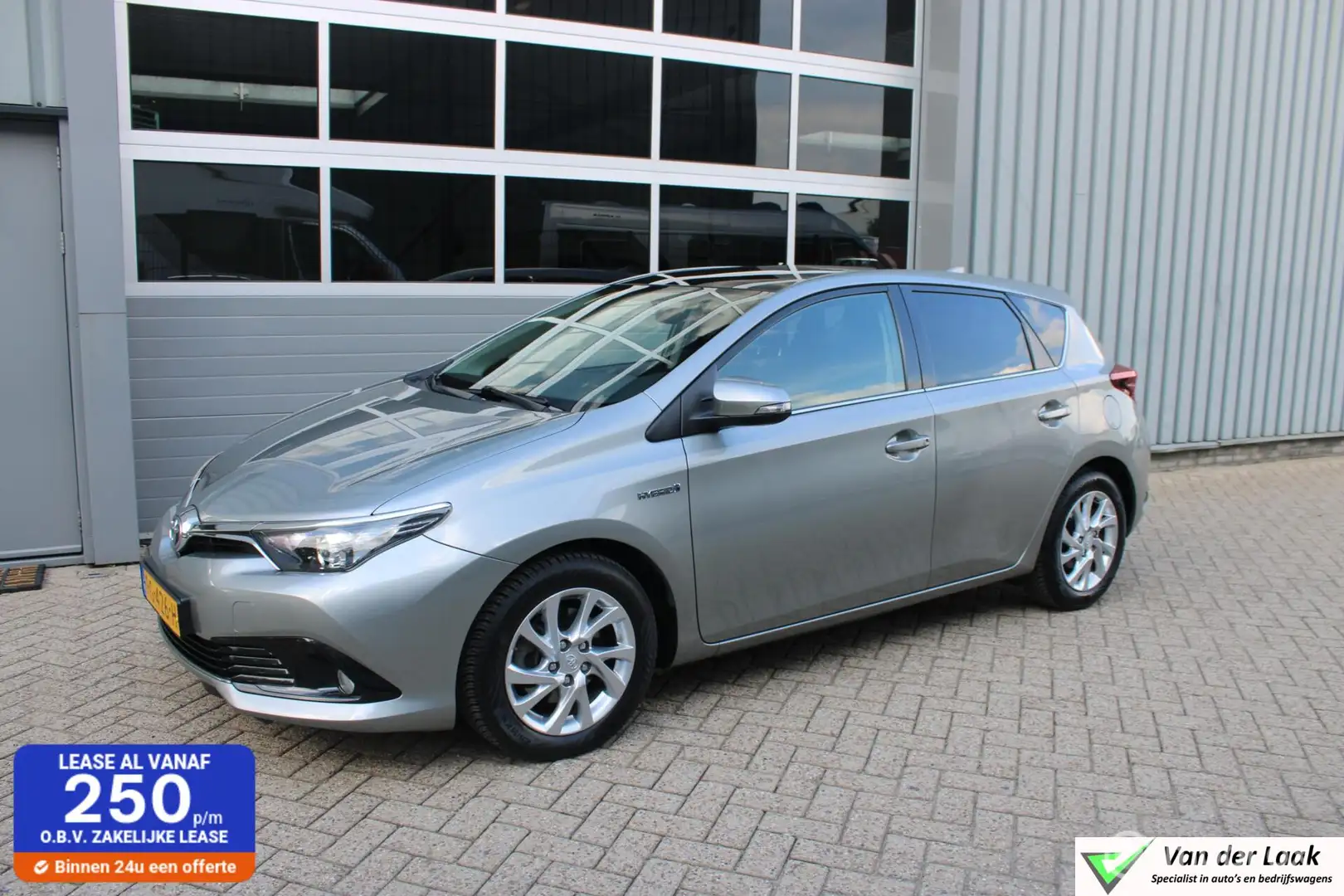 Toyota Auris 1.8 Hybrid Trend NL Auto | 1e Eigenaar | Panoramad Grijs - 1
