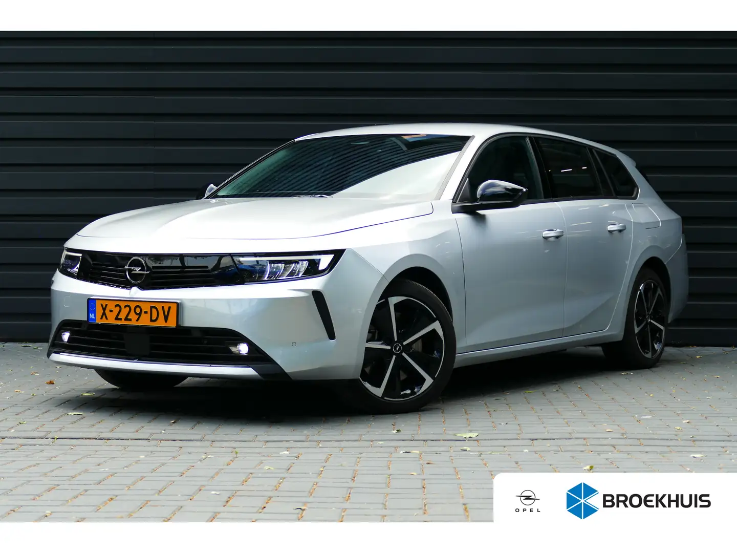 Opel Astra Sports Tourer 1.6 Hybrid 180pk Edition / NAVI (App Grijs - 1