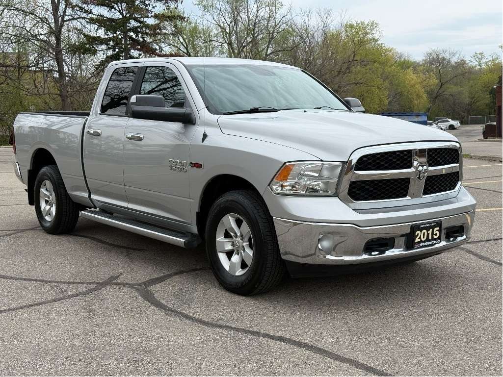 2015 RAM 1500 4WD Quad Cab 140.5 SLT — снимка 1