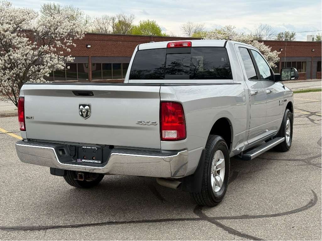 2015 RAM 1500 4WD Quad Cab 140.5 SLT — снимка 1