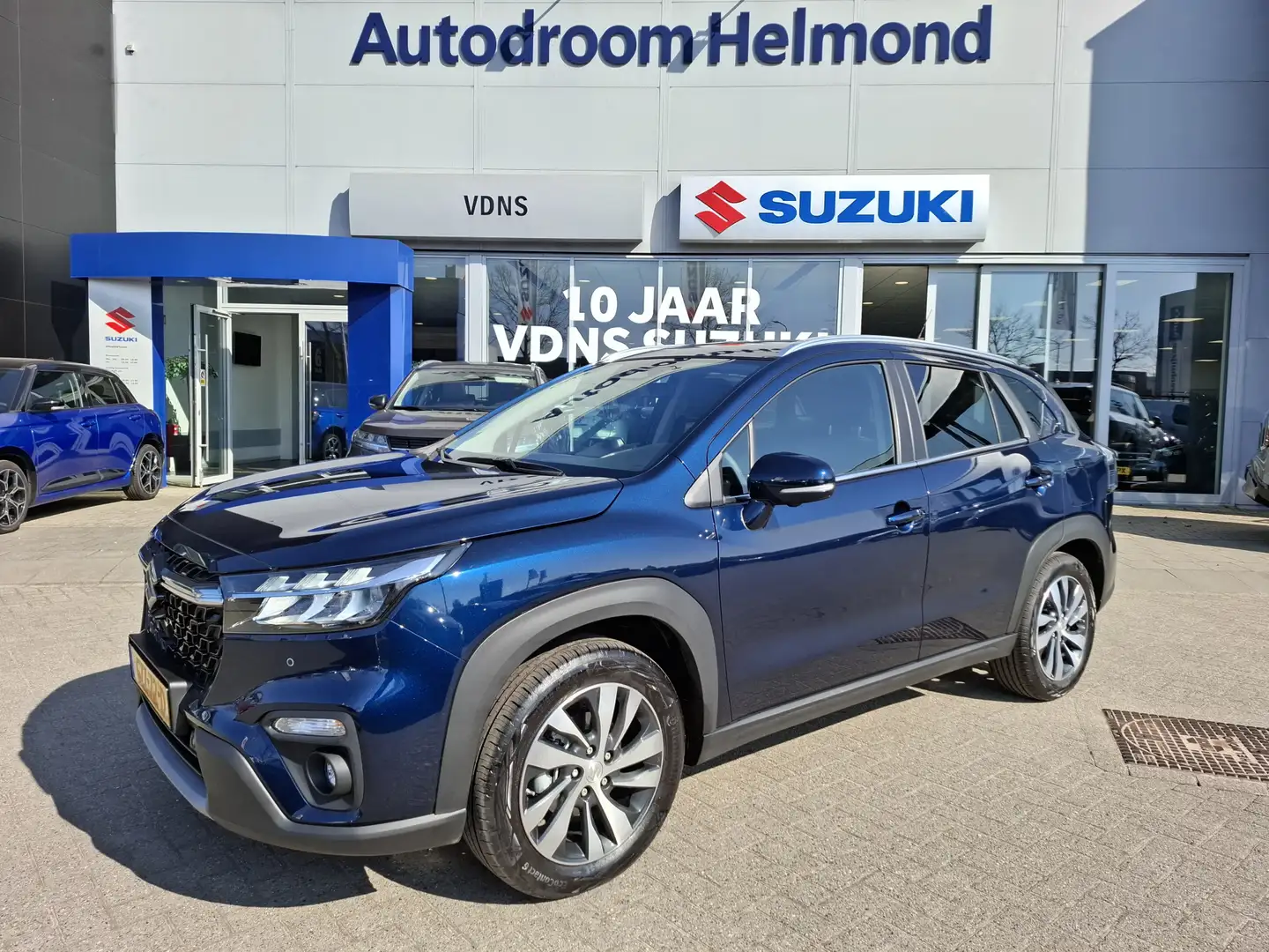Suzuki S-Cross 1.5 Hybrid Style Demo, meest luxe uitvoering per d Blauw - 1