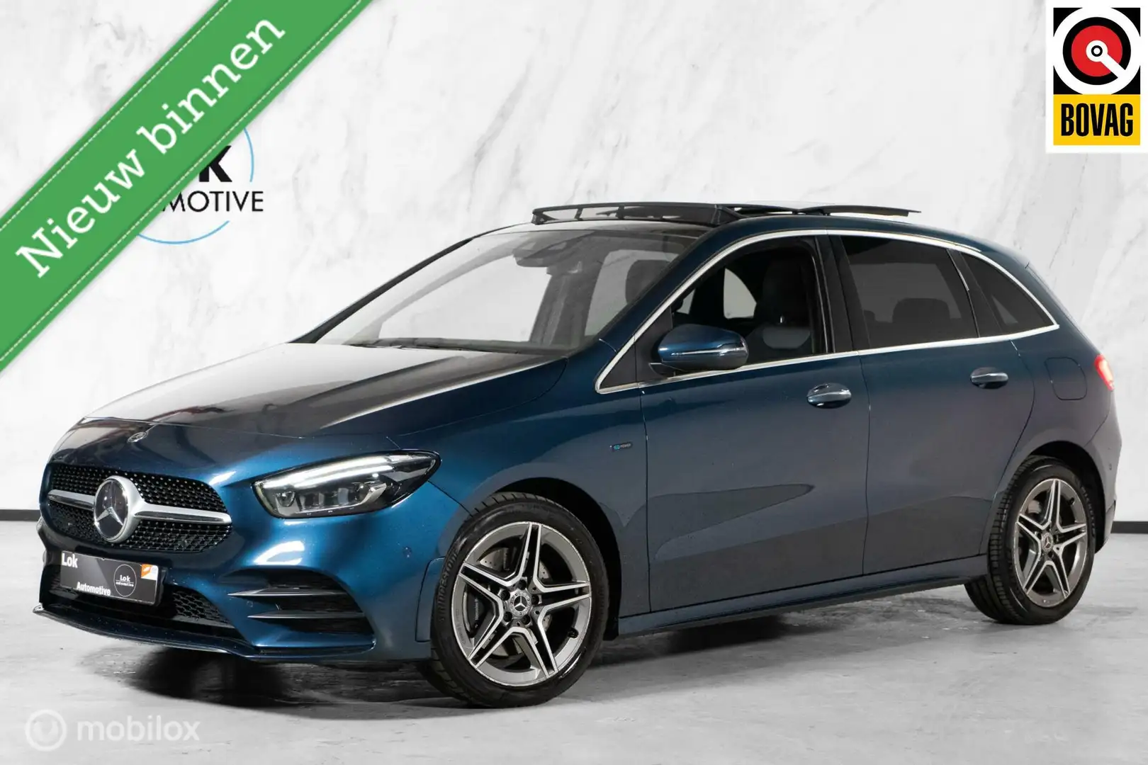 Mercedes-Benz B 250 e Business Solution AMG PANO|SFEER|LED Blauw - 1