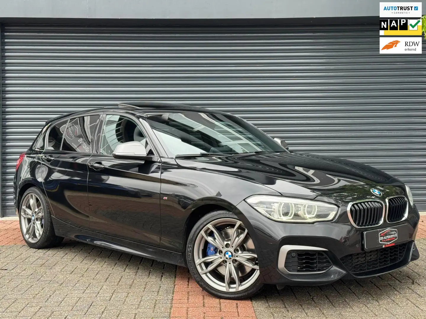 BMW 140 1-serie M140i xDrive High Executive Lci2 | X - Dri Zwart - 1