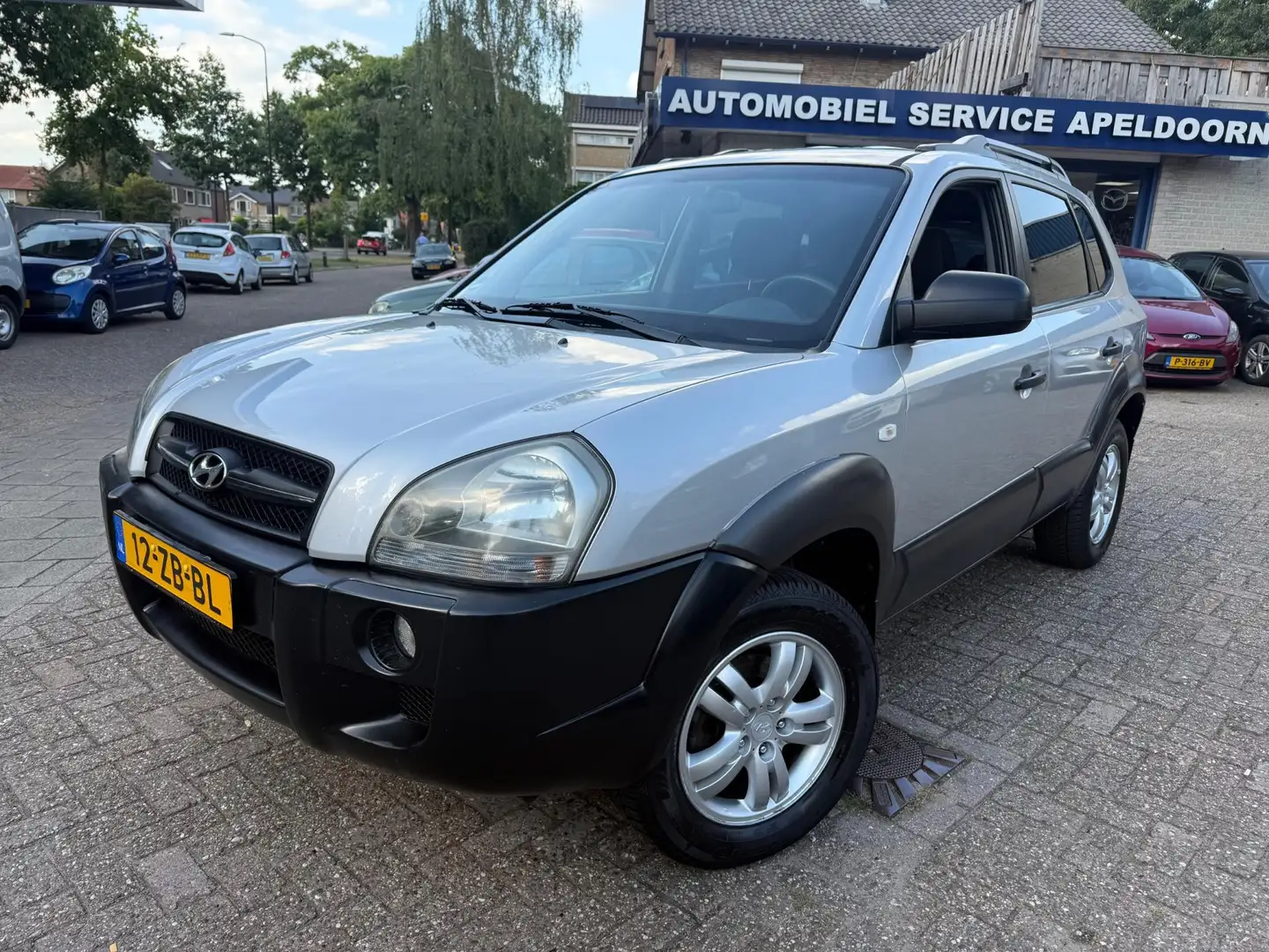 Hyundai TUCSON 2.0i Dynamic Cross *APK*CRUISE*AIRCO*TREKHAAK*LM. Grijs - 1