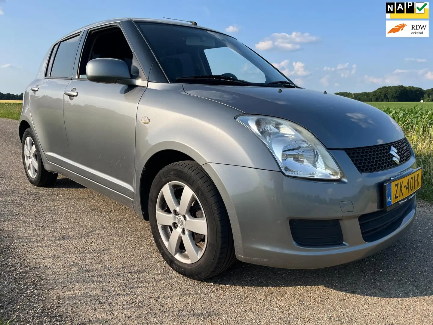 Suzuki Swift 1.3 Comfort | Airco| Grijs - 1