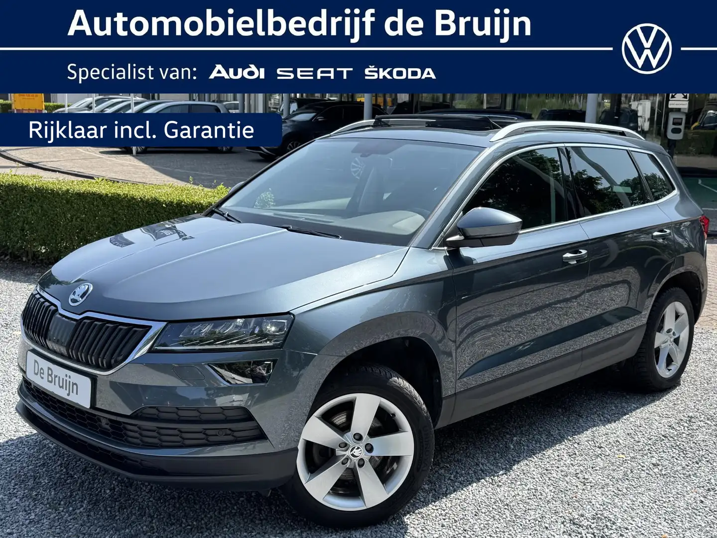 Skoda Karoq 1.5 TSI 150pk DSG Style (Pano,Trekhaak,Clima,Navi, Grijs - 1