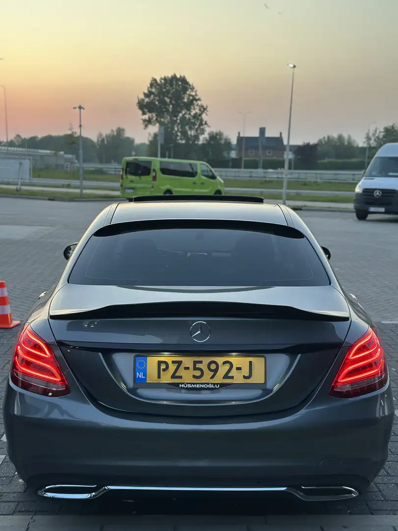 Mercedes-Benz C 180 9G-TRONIC AMG Line Grijs - 1