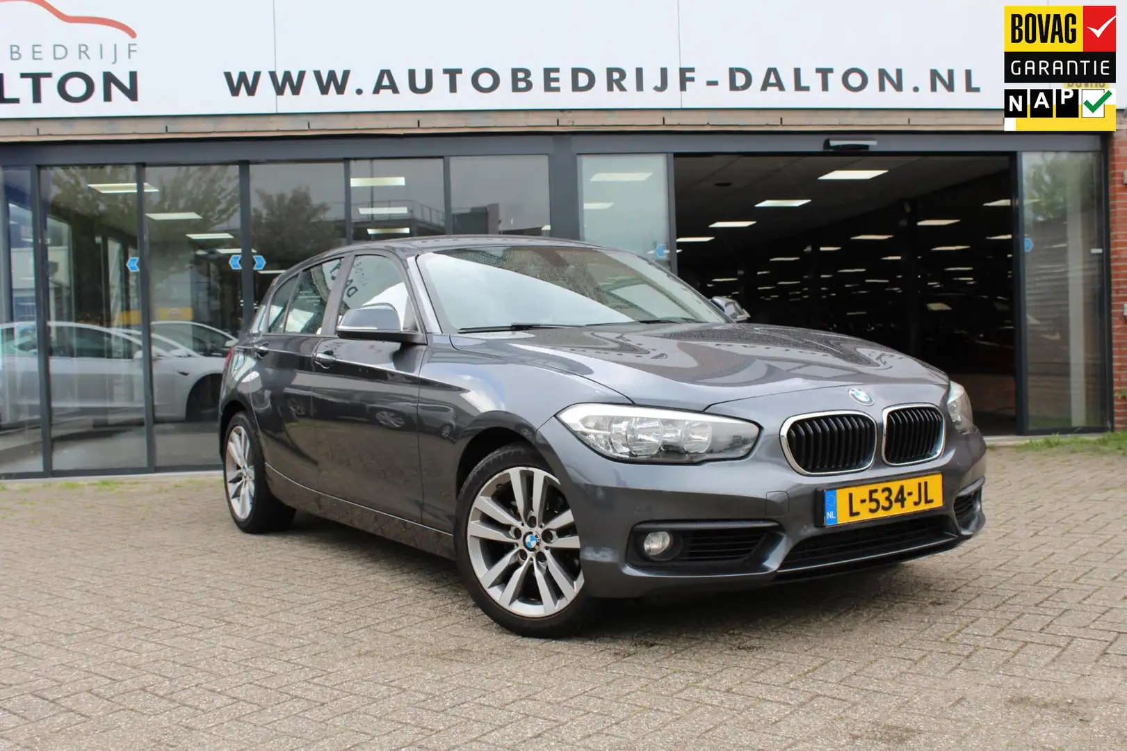 BMW 118 1-serie 118i 5 DEURS / AUTOMAAT / LEER / NAVIGATIE Gris - 1