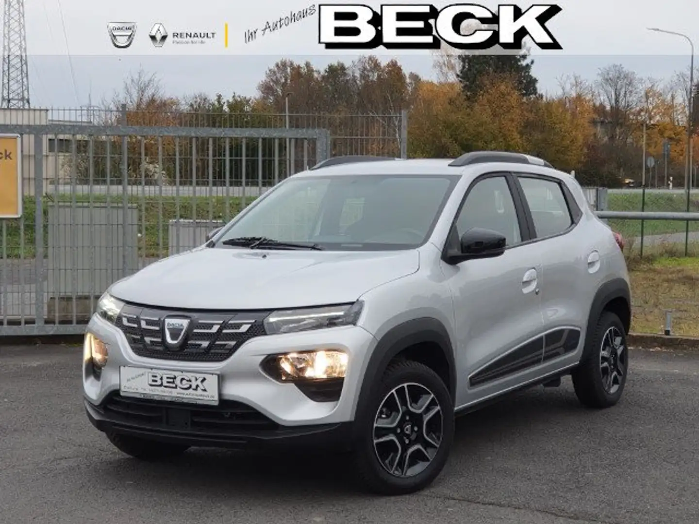 Dacia Spring Comfort Plus | Allwetter,Klima,Navi,PDC,Licht+Rege Silber - 1