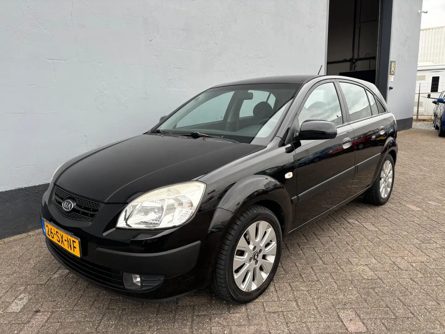 Kia Rio 1.4 LXE - LMV Zwart - 1