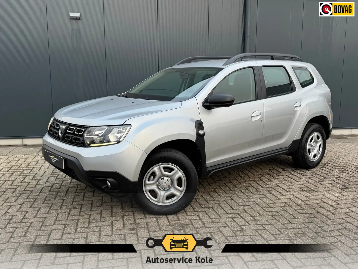 Dacia Duster 1.3 TCe 130pk Comfort * Navigatie * Cruise Control Gris - 1