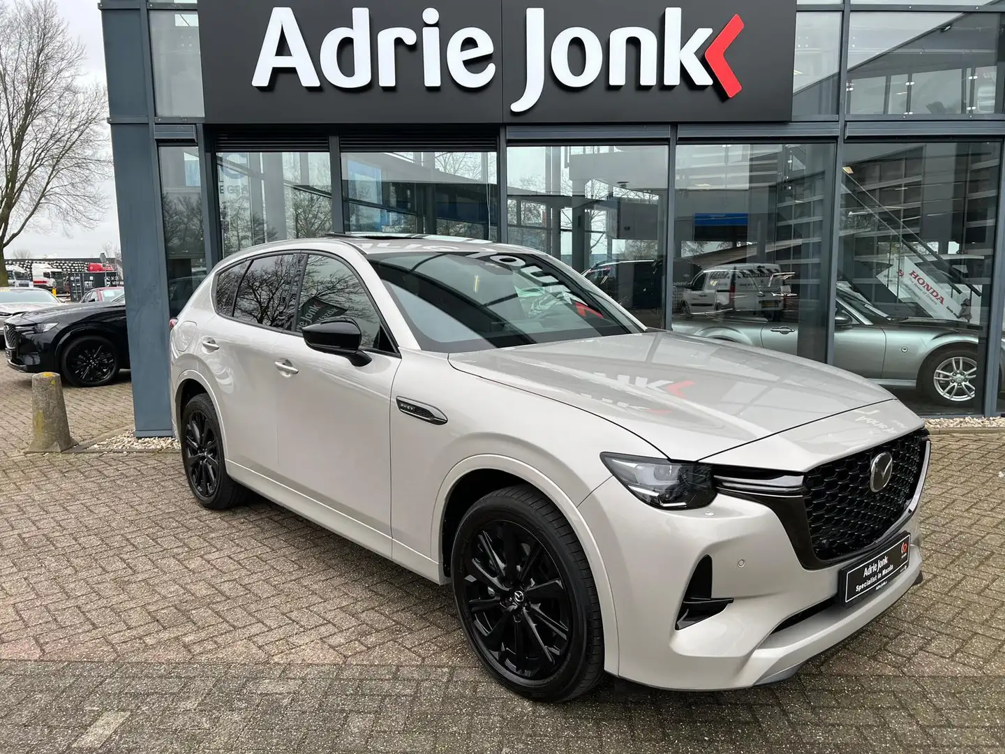 Mazda CX-60 2.5 e-SkyActiv PHEV Homura Plus AUTOMAAT | PLUG-IN Braun - 1