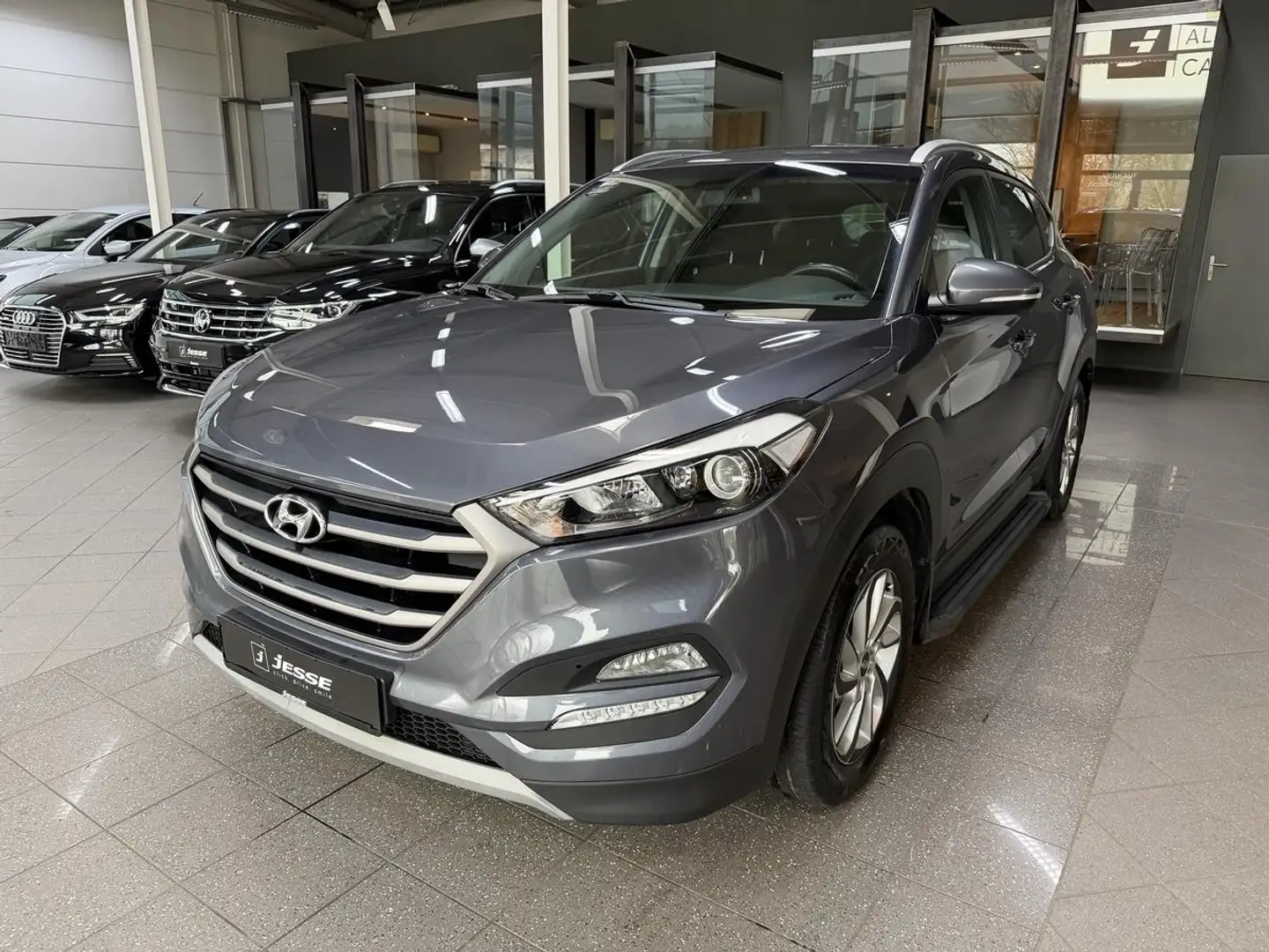 Hyundai TUCSON 1.6 Trend Temp R.Cam SHZ AHK Grau - 1