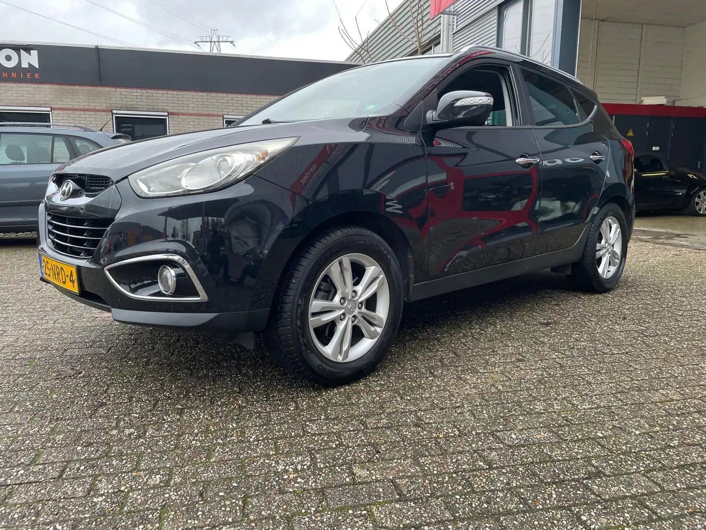 Hyundai iX35 2.0i Style navi camera nette auto Zwart - 1