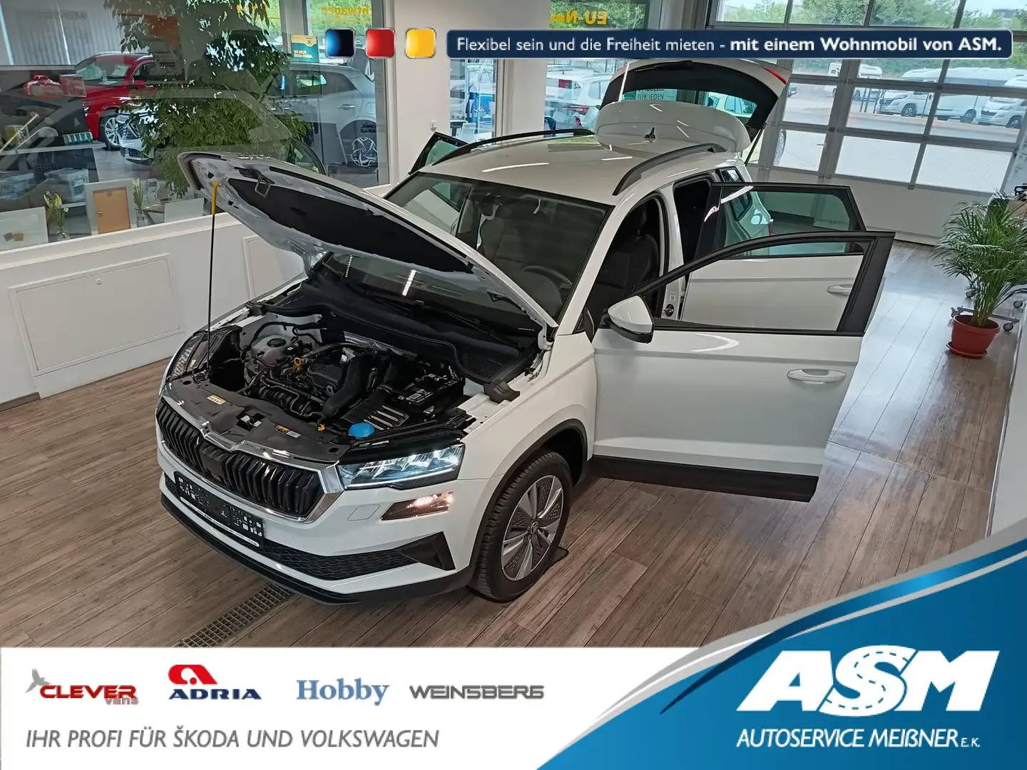 Skoda Karoq Style 1,5TSI DSG*AHK-VORBER*NAVI*LED*R-KAM Weiß - 1