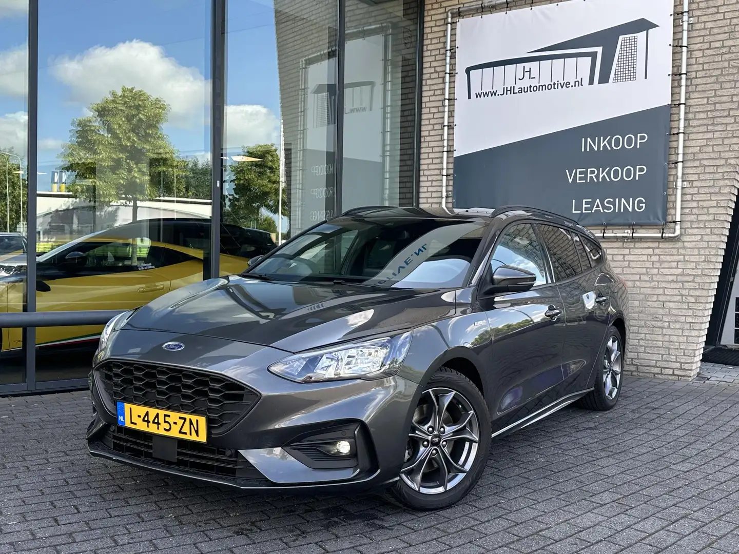 Ford Focus Wagon 1.0 EcoBoost Hybrid ST Line*ECC*CRUISE*NAVI* Grijs - 1