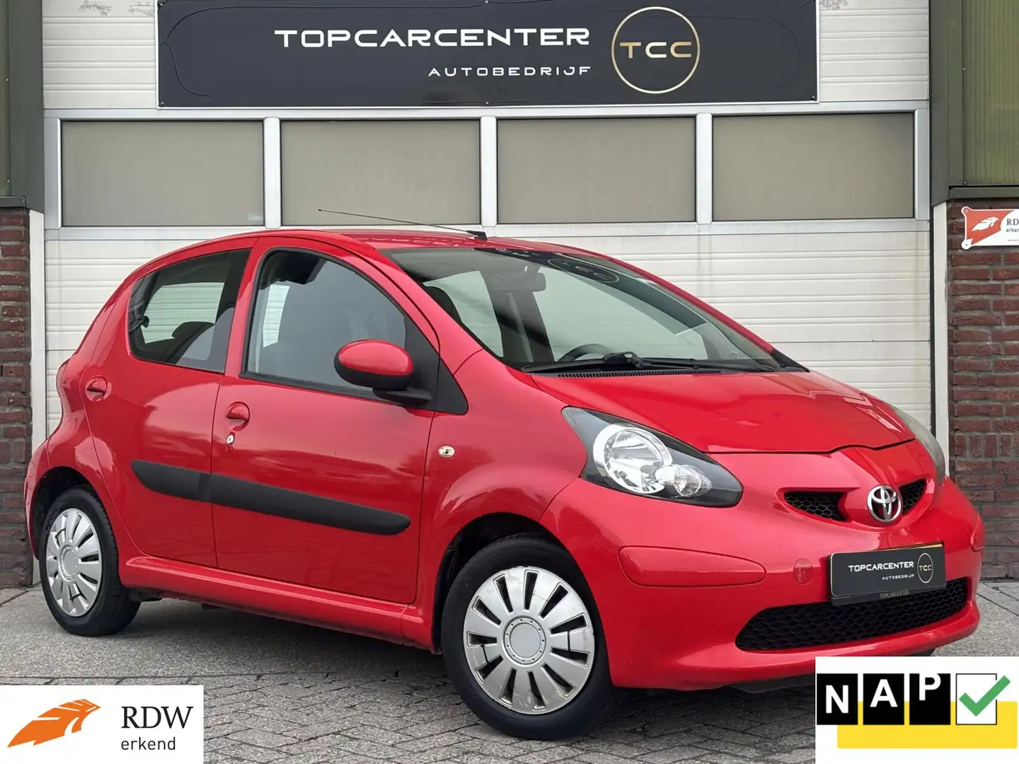 Toyota Aygo 1.0-12V +/AIRCO/AUT/PARKS/5DRS/APK/NAP Rot - 1