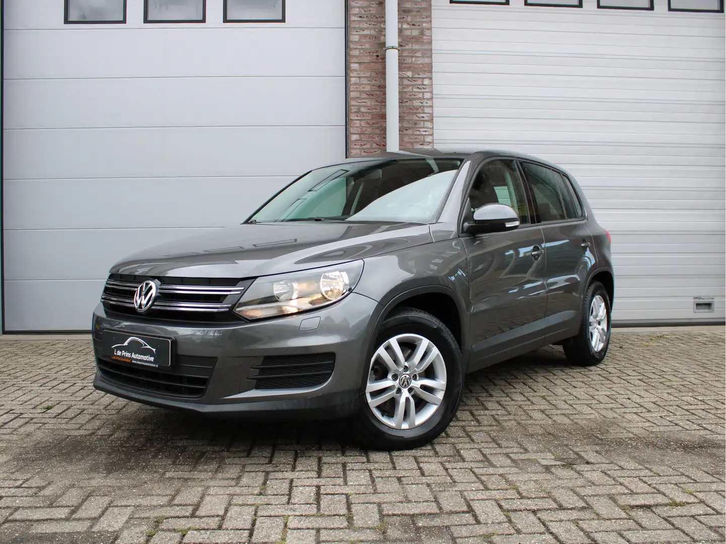 Volkswagen Tiguan 1.4 TSI Comfort&Design Edition Afneembare trekhaak Gris - 1