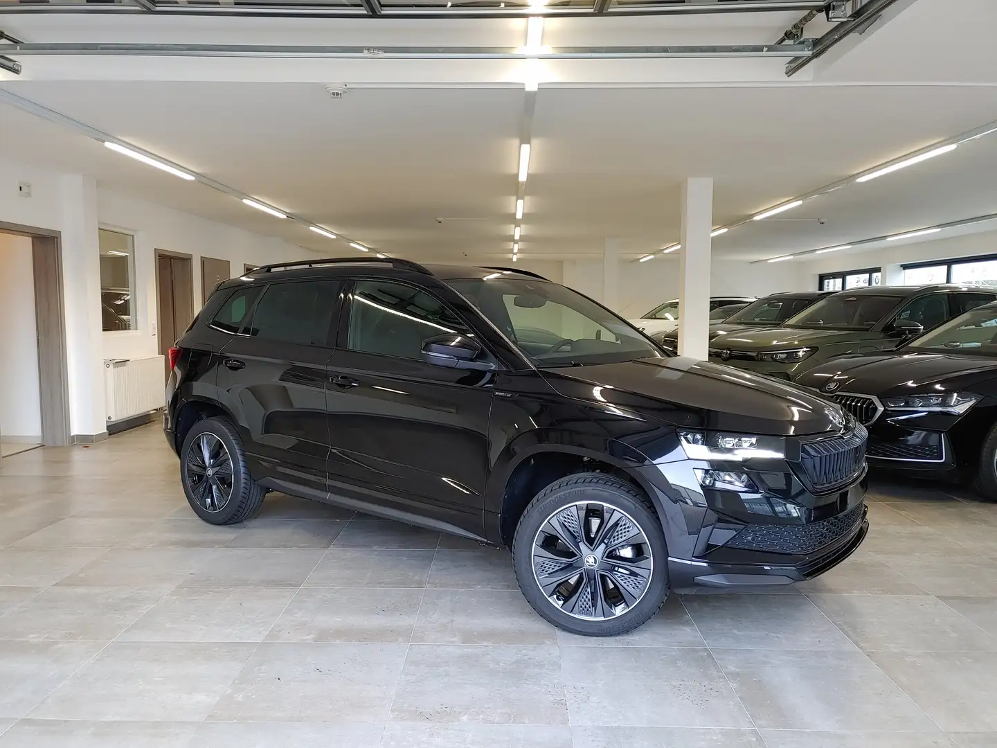 Skoda Karoq 1.5 TSI DSG Sportline AHK/Navi/EasyOpen/ACC/Kamera Schwarz - 1