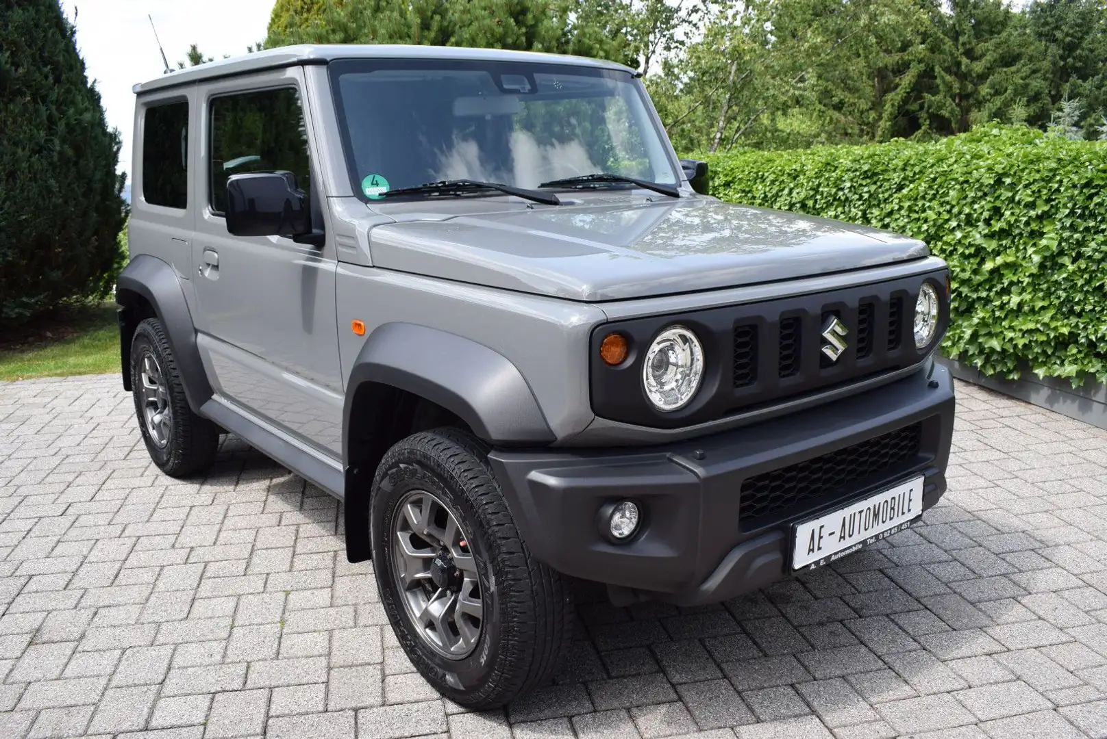 Suzuki Jimny Comfort+ Allgrip AHK/1.HD/SUZUKI SH GEPFL. Gris - 1