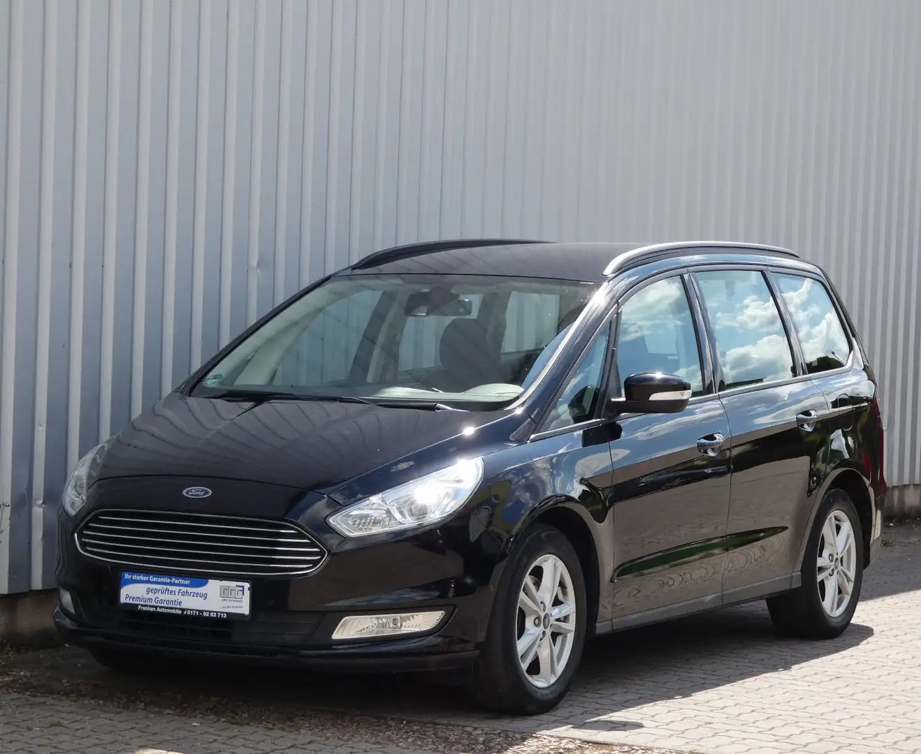 Ford Galaxy Business-7.Sitzer-Klima-Navi-AHK-PDC-Alu Schwarz - 1