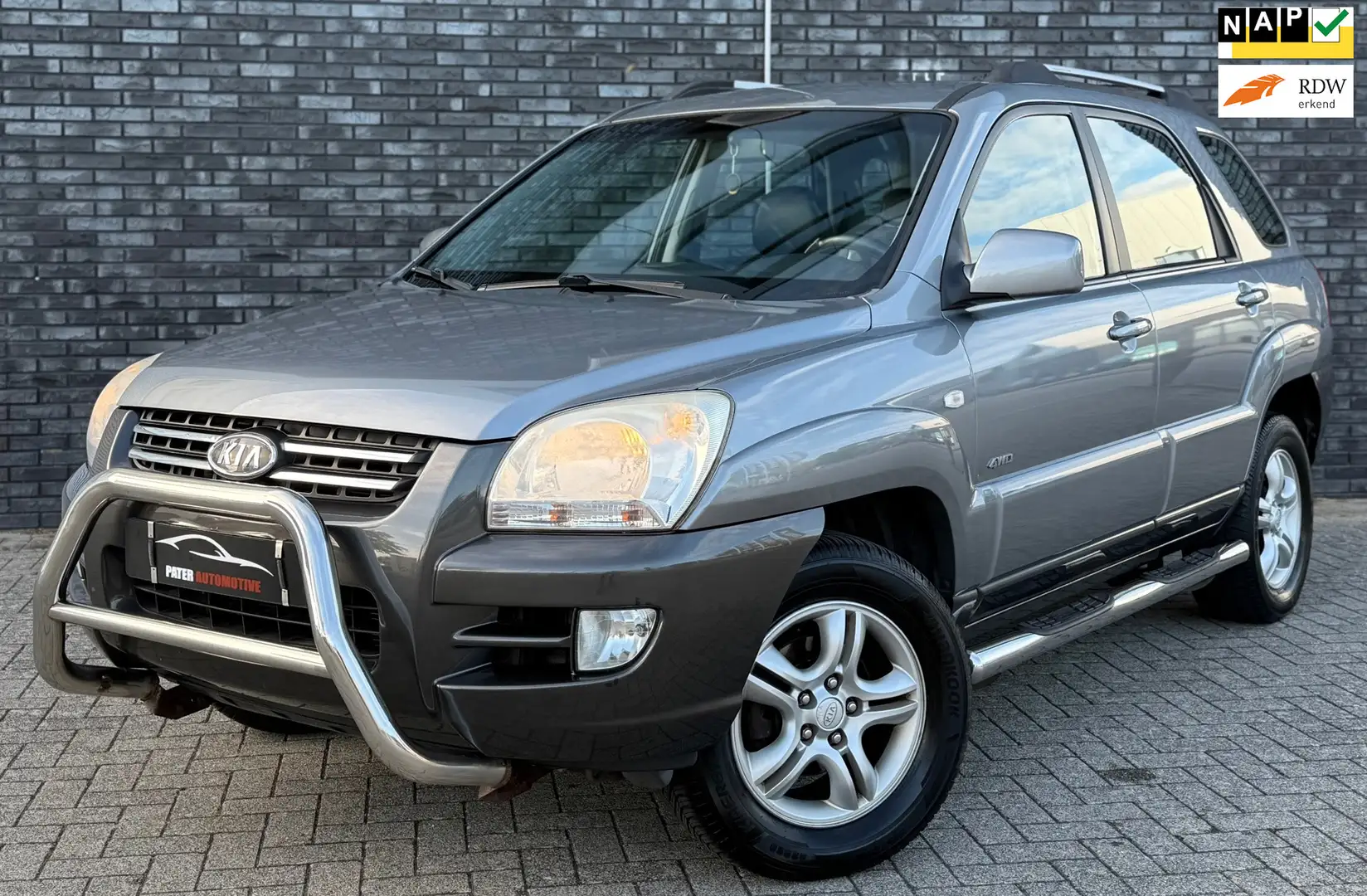 Kia Sportage 2.0 CVVT Adventure 4WD Cruise Control|Navigatie|Tr Grijs - 1