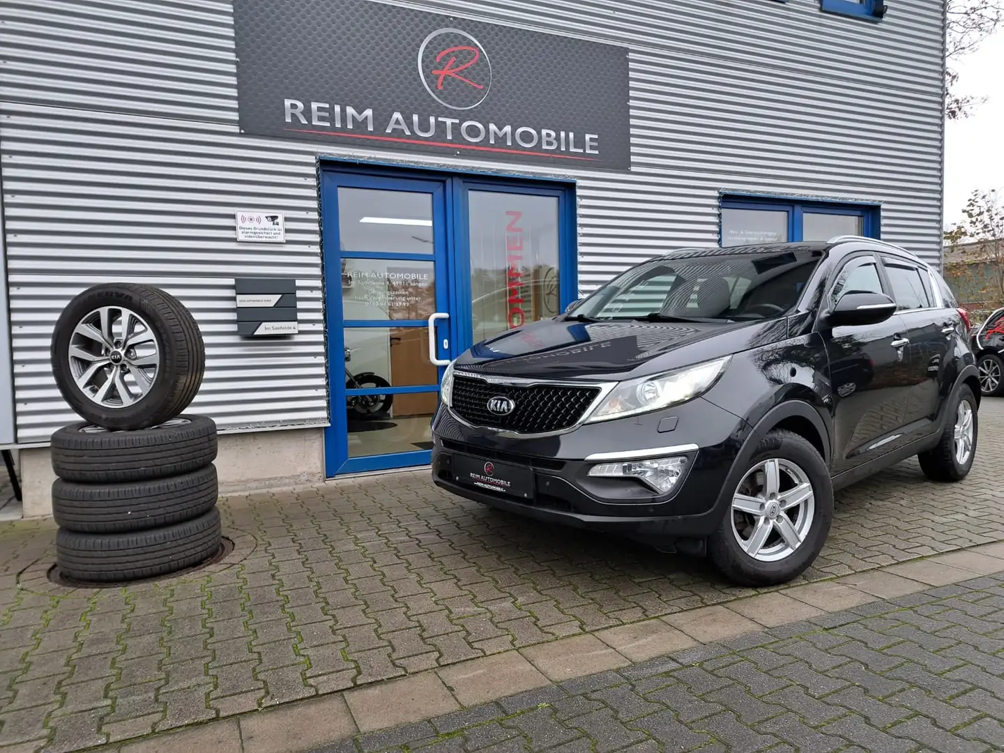 Kia Sportage 1.6 Attract 2WD *NAVI*KAMERA*SHZ*LEDER*PANORAMA D Negru - 1