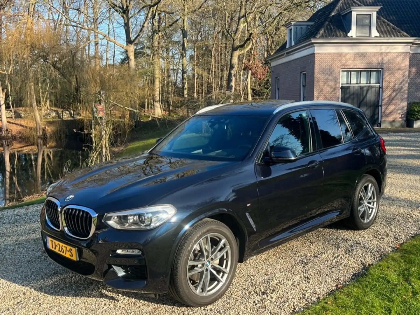 BMW X3 XDRIVE 20i HIGH EXE NL-auto M-PAKKET PANO Schwarz - 1