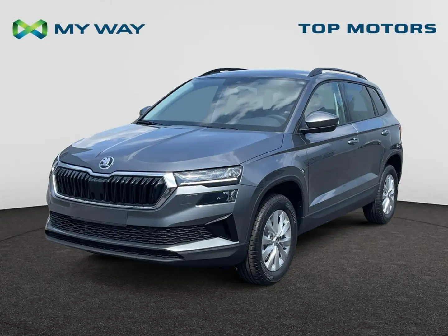 Skoda Karoq *DIRECTIEWAGEN*1.5 TSI 110kW (150pk) DSG7*FAMILY*ZETELVERWARMING VR*TREKHAAK*ELEKTR KOFFER*CAMERA* Grijs - 1