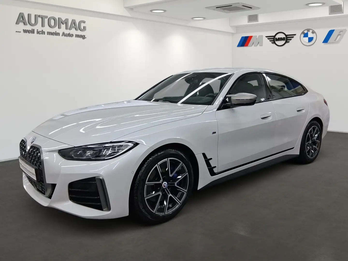 BMW M4 40i xDrive DrivAssProf*ParkAssPlus*AHK*HeadUp*Harm Weiß - 1