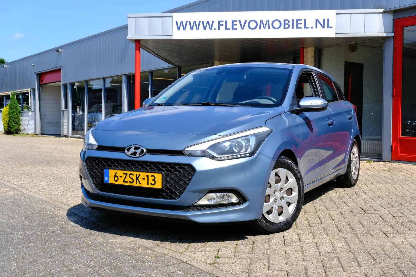 Hyundai i20 1.2 HP i-Motion 5-drs Airco|Cruise|PDC Blauw - 1