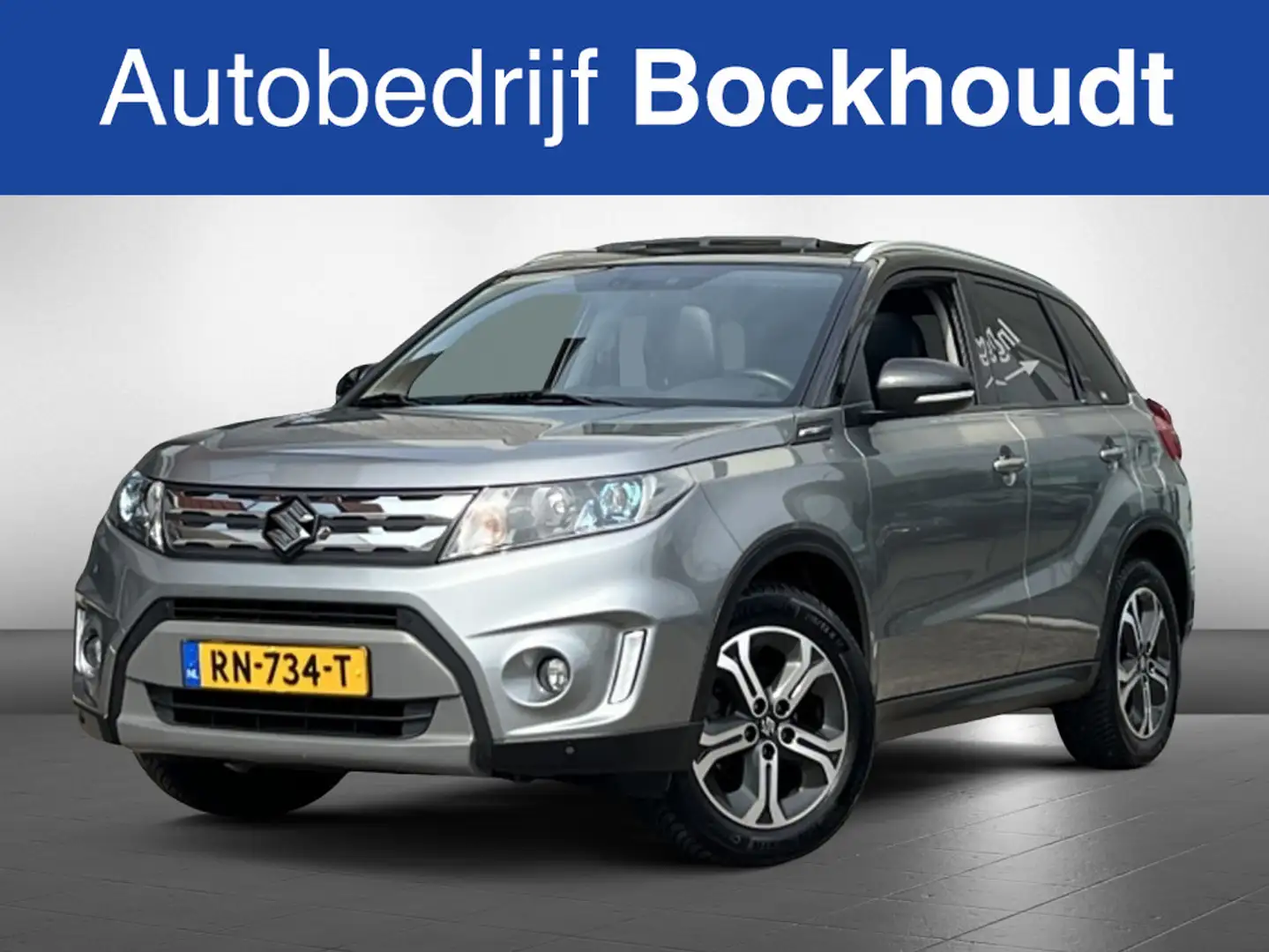 Suzuki Vitara 1.6 High Executive | Pano | Navi | Camera | Trekha Grijs - 1