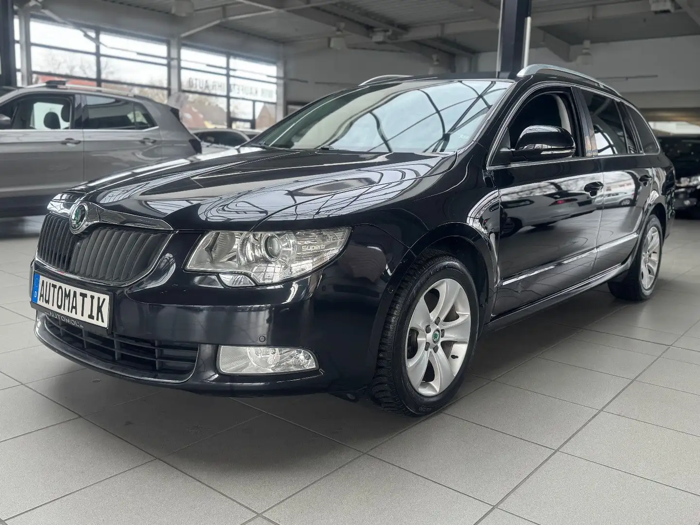Skoda Superb Combi 1.8TSI DSG Ambition PDC Navi uvm. Schwarz - 1