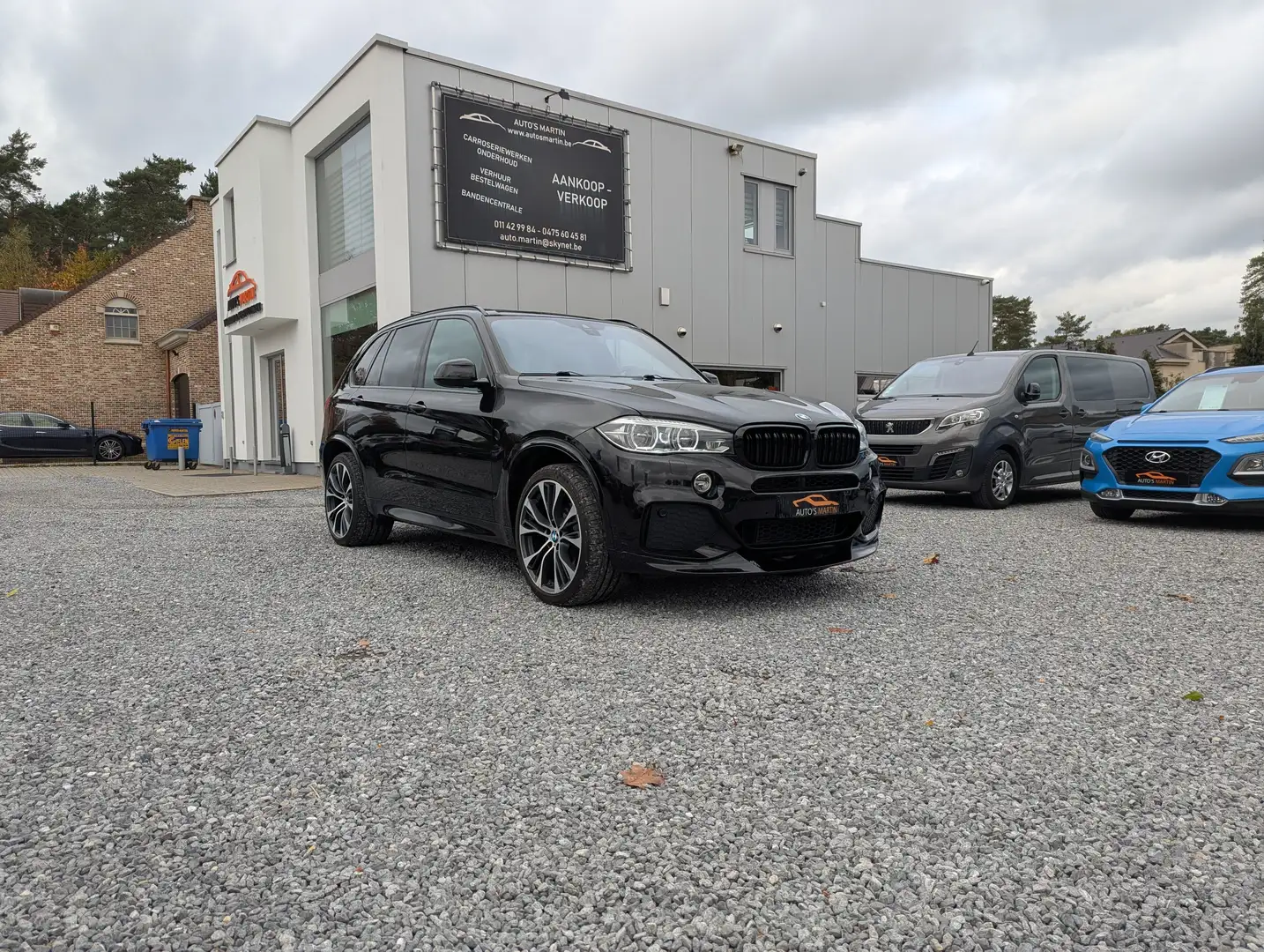 BMW X5 xDrive30d M Pakket | PANO | MEMORY | HUD | FULL Zwart - 1