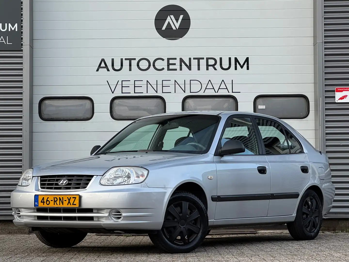 Hyundai ACCENT 1.3i Active APK 03-2026 AIRCO/TREKHAAK/EL. RAMEN Gris - 1