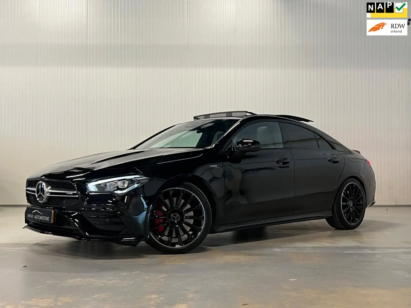 Mercedes-Benz CLA 35 AMG 4MATIC Premium Plus | AERODYNAMIC | PANO | AMBIANC Zwart - 1